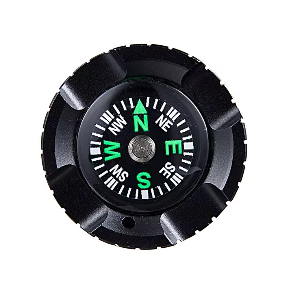 Top-down view of a black compass with green and white markings—ideal for adventure or pairing with the Outdoor Flashlight SpyCam.