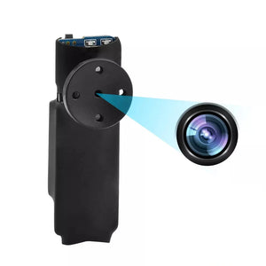 A person holds the Shirt Button SpyCam, a sleek black camera device that evokes the essence of James Bond gadgets, complete with a lens emitting a blue beam of light. The allure of hidden cameras and the sophistication of this innovative design are seamlessly intertwined.