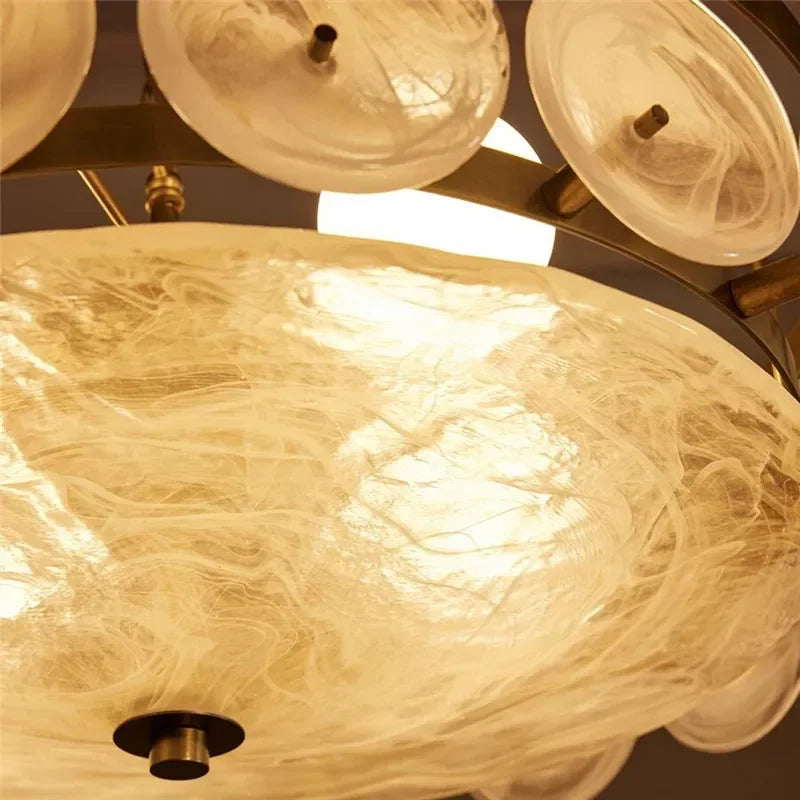 Close-up of the Italian Retro Pendant Light featuring circular, translucent glass shades and a central light source that highlights the elegant swirling patterns within the Murano-style glass.
