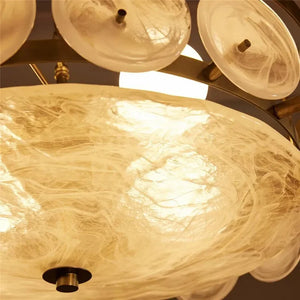 Close-up of the Italian Retro Pendant Light featuring circular, translucent glass shades and a central light source that highlights the elegant swirling patterns within the Murano-style glass.
