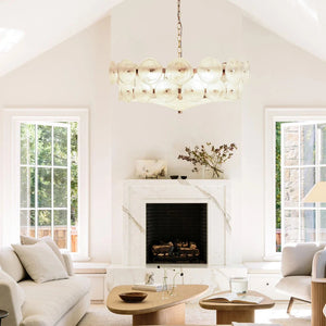 Bright living room with two large windows, marble fireplace, light sofas, wood coffee table, minimalist decor, and the Italian Retro Pendant Light as an elegant centerpiece.
