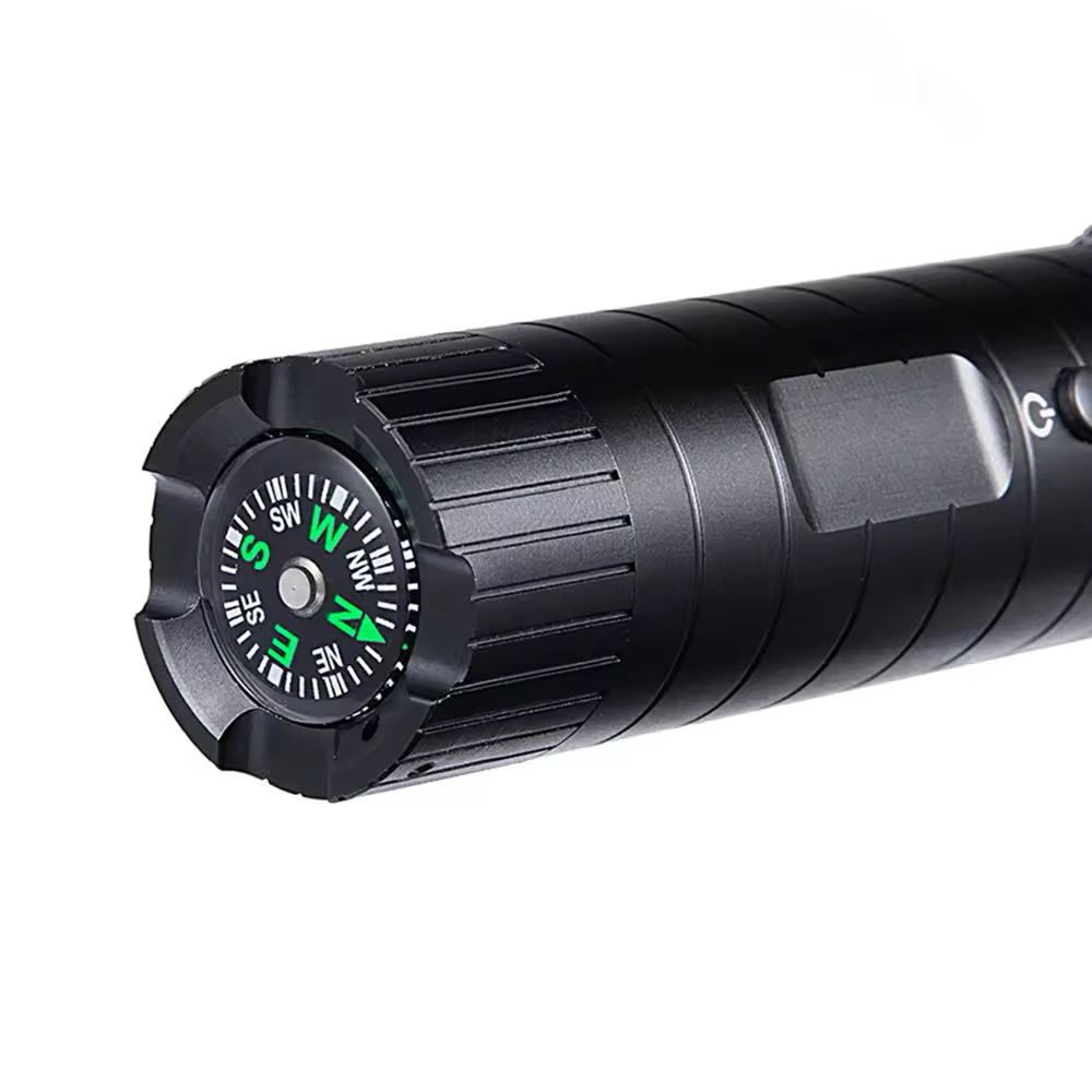 A close-up of the Outdoor Flashlight SpyCam, a black waterproof flashlight with a built-in compass on the end and designed for prolonged battery life.