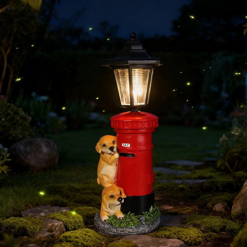 The Solar Dog Light is a charming garden decoration featuring a lamp post shaped like a red mailbox, accompanied by two small puppy statues. This vintage-style solar street lamp casts a warm glow at night, beautifully illuminating your garden among the fireflies.