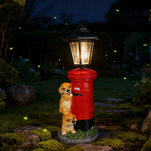 The Solar Dog Light is a charming garden decoration featuring a lamp post shaped like a red mailbox, accompanied by two small puppy statues. This vintage-style solar street lamp casts a warm glow at night, beautifully illuminating your garden among the fireflies.