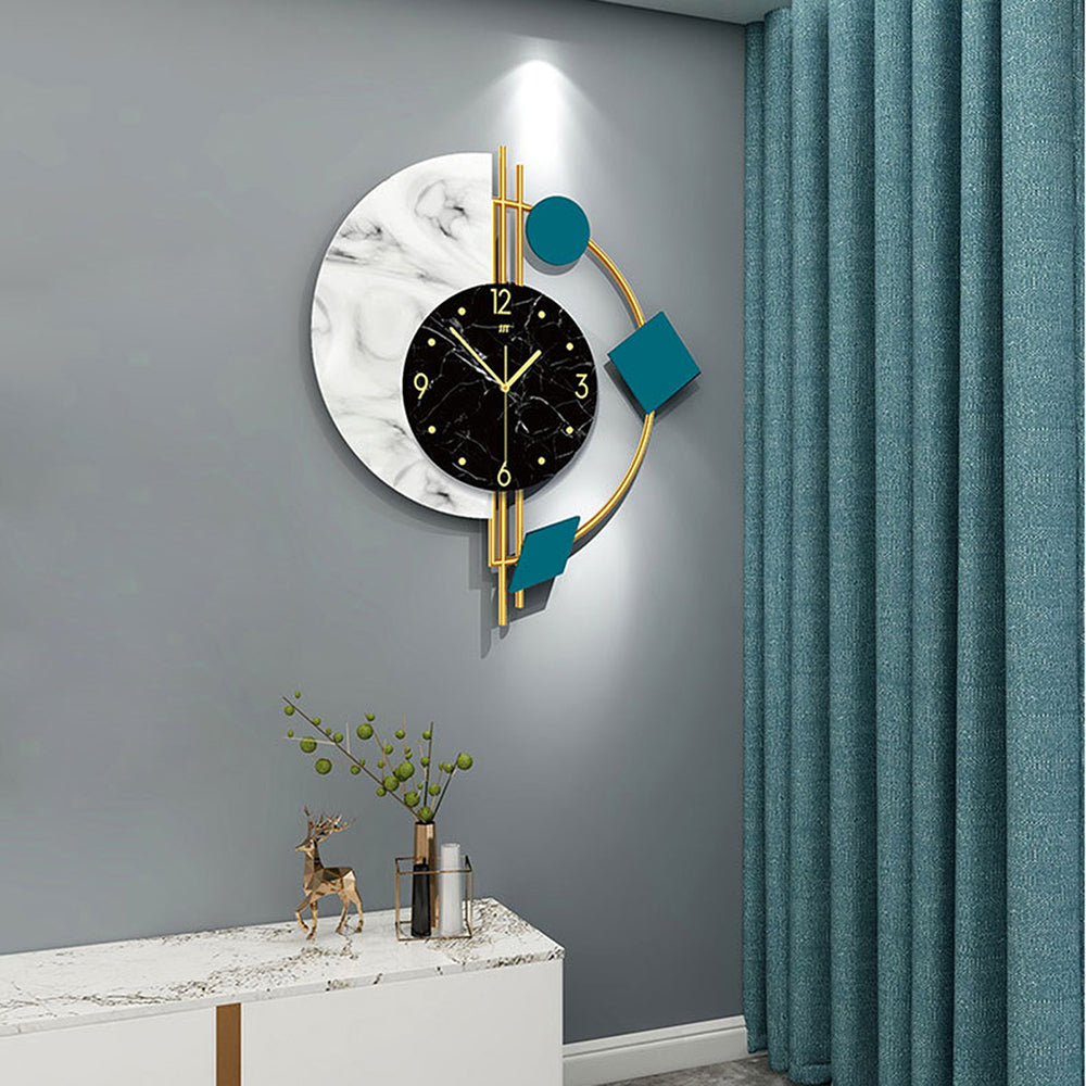 The Modernist Constellation Accent Clock with geometric design hangs on a gray wall above a white cabinet with minimalist decor; teal curtains appear on the right.