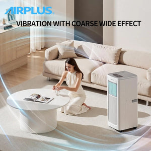 A woman in a white dress sits on the floor by a round coffee table, with the Powerful Air Conditioner nearby in a modern living room designed for Modern Homes. Text reads "POWERFUL COOLING WITH COARSE WIDE EFFECT.