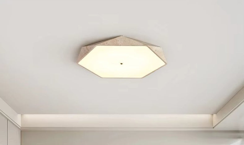Natural Stone Ceiling Light featuring a hexagonal shape with a white diffused cover and beige frame, inspired by wabi-sabi lighting, mounted on a smooth white ceiling in a modern room.