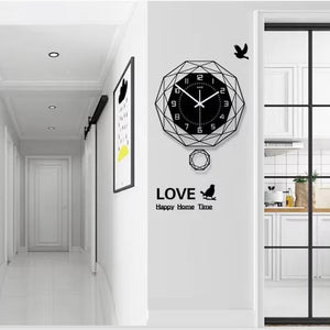 The hallway, with minimalist decor, includes a Minimalist Polygon Wall Clock and framed art by the sliding kitchen door. Birds elegantly fly around the word "LOVE" on the wall, enhancing the charm of this stylish space.