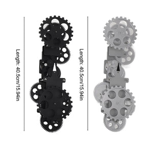 The Ring Gear Wall Clock consists of two sets of interlocking gears, one black and the other gray, each measuring 40.5 cm in length. Its dynamic design and sophisticated presence make it a perfect addition to any modern interior.