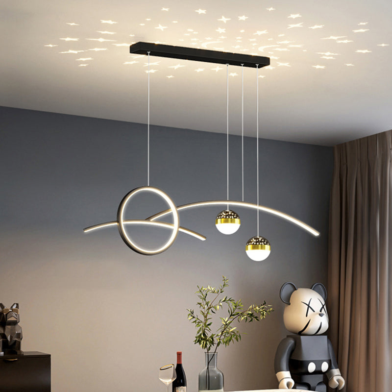 A modern room showcases the Stellar Pendant Light, highlighting its circular and linear geometric glow. Below, a decorative bear figurine sits on a table alongside a wine bottle, glass, and potted plant.