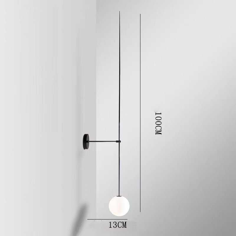 The Minimalist Line Light showcases a sleek black wall mount and round white bulb, with a 100 cm height and 13 cm horizontal rod length, embodying modern elegance and balancing form with function.
