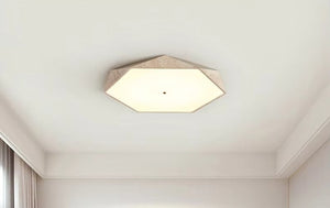 Natural Stone Ceiling Light featuring a beige-bordered hexagonal design and wabi-sabi aesthetic, mounted on a white ceiling in a neutral-toned room with white walls and curtains.