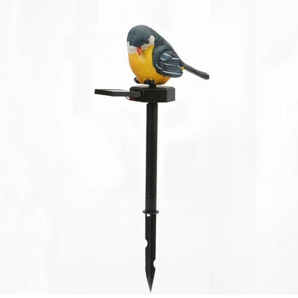 A Solar Bird Light perched atop a black garden stake, showcased against a plain white background.