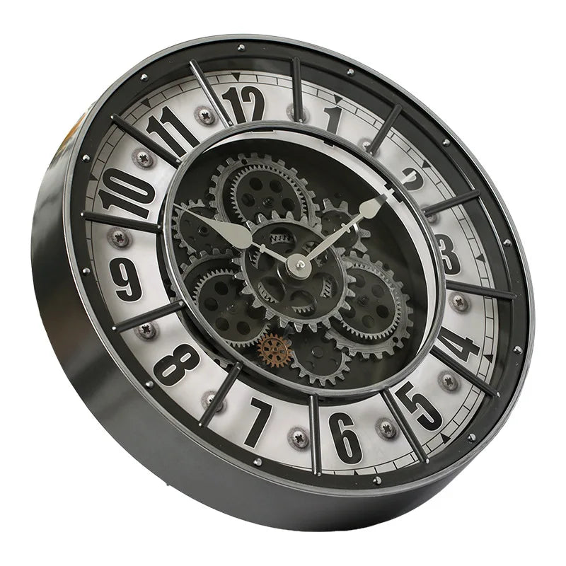 The Industrial Gearworks Wall Clock features a round metallic frame, exposed decorative gears at the center, and bold black numbers on a white background.