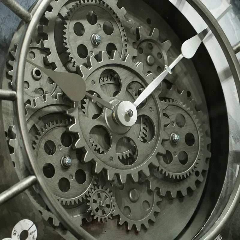 Close-up of the Industrial Gearworks Wall Clock face with exposed metal gears and two silver hands showing the time at about 10:08.