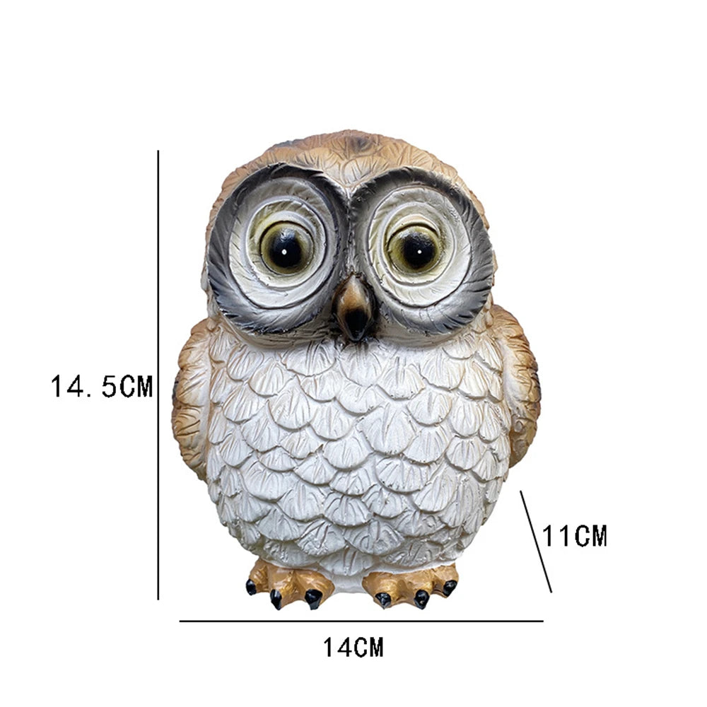 The Solar Owl Light is a realistic owl figurine measuring 14.5 cm tall, 14 cm wide, and 11 cm deep, designed as an enchanting addition to your outdoor solar decor. It is shown on a white background with measurement lines.