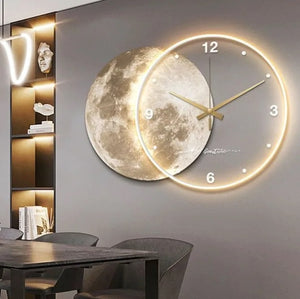 The wall displays a Celestial Wall Clock Light, capturing 7:10 with its moon-themed design, while the shelf below features unique home decor items that elevate the space's cosmic imagery.