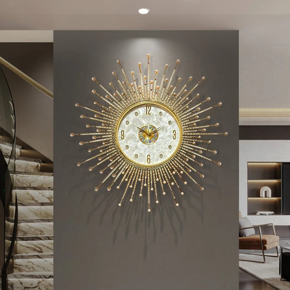 The Premium Sun Wall Clock, featuring a large gold sunburst design, is mounted on a gray wall in a modern interior with marble stairs and contemporary decor.