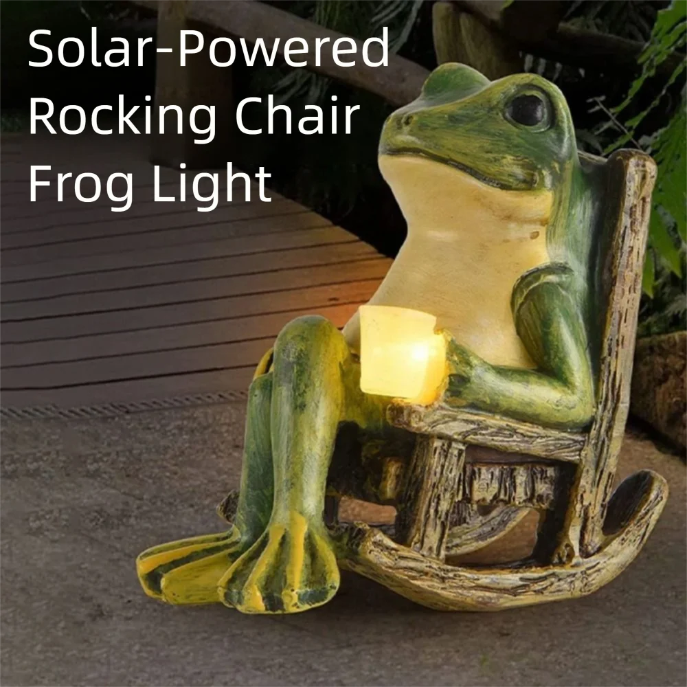 A whimsical garden frog statue, the Solar-powered Rocking Chair Frog Light, sits in a rocking chair holding a glowing light. Perfect as outdoor rocking chair decor, this charming piece is surrounded by plants and set on a wooden walkway.