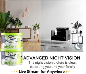 Image displaying two cans of air freshener with plants on a wooden floor next to a half-colored photo of a modern living room. The text promotes the advanced night vision and live streaming capabilities of the Fake Decorative Display SpyCam, cleverly disguising the hidden camera as part of your decor for discreet surveillance.