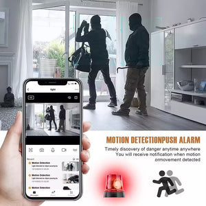 A person holds a Clock Wireless Charging Station SpyCam showing a home security app. Through glass doors, two individuals with a crowbar are visible. Text highlights motion detection and alarm notification features, captured clearly with the device's integrated 4K camera.