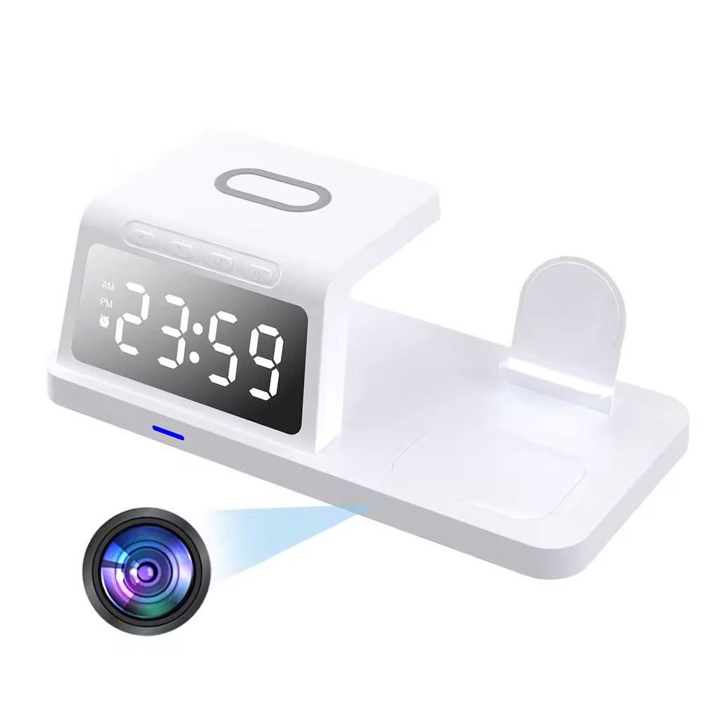 The Clock Wireless Charging Station SpyCam is a sleek white digital clock that displays 23:59, discreetly housing a hidden 4K camera and incorporating a wireless charging pad for enhanced functionality and versatility.