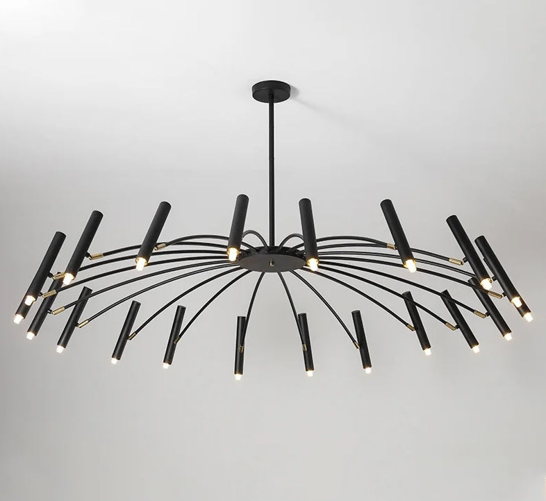 A large, black and contemporary candle style chandelier, featuring adjustable lighting, hanging in a room.