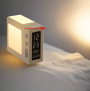 The Night Light Clock SpyCam sits on a bedside table, its glowing light illuminating the surroundings. The display shows the time as 12:12 and the date as 2023. This sleek device not only tells time but also doubles as a SpyCam, offering 1080P HD recording for your peace of mind, with buttons conveniently located on its side.