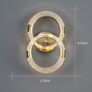 The Elegant Ring Wall Sconce, featuring two interlocking illuminated rings, is displayed against a grey background with dimensions: Height 33cm and Length 20cm.