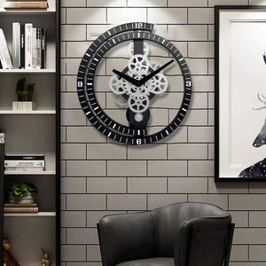 A contemporary industrial vibe is brought to life with the Industrial Gear Wall Clock, showcasing exposed gears while mounted on a gray brick wall above a leather chair. Flanking bookshelves and artwork add character to the space.