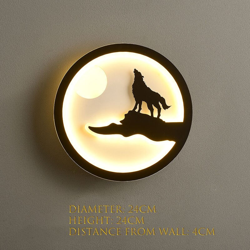 The Minimalist Wall Lamp showcases a design with the silhouette of a howling wolf and moon, emitting a soft and warm glow. Ideal for contemporary homes, it has dimensions of 24cm in diameter, 24cm in height, and protrudes 4cm from the wall.