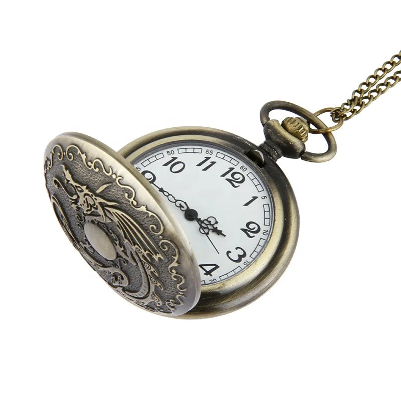 A High Quality Cheap Vintage Dragon Engraved Quartz Old Pocket Watch Relojes Antiguos Bolsillo with an ornate cover, white clock face, black numerals, and metal chain.