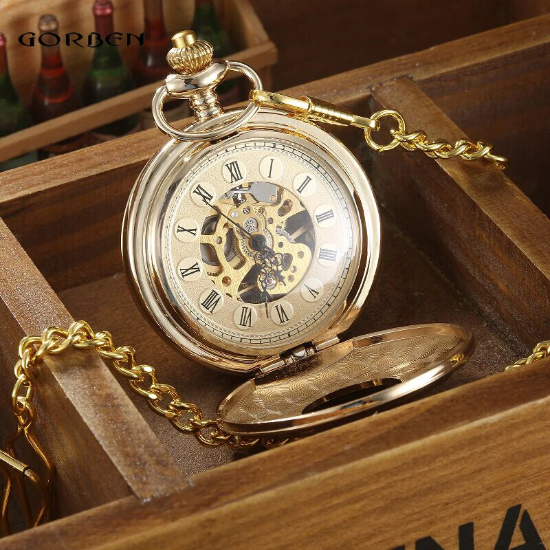 The Vintage Mechanical Pocket Watch with visible movement, Roman numerals, and an ornate chain is displayed in a wooden box.