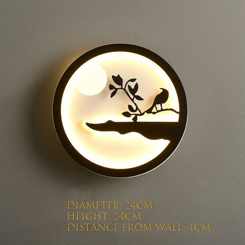 The Minimalist Wall Lamp features a bird-on-branch silhouette, emitting a soft and warm glow. Its dimensions are 24cm in diameter, 24cm in height, and extends 4cm from the wall, ideal for any modern home.