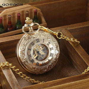 The Vintage Mechanical Pocket Watch, featuring Roman numerals and exposed gears, hangs from a gold chain and sits gracefully atop a wooden box.