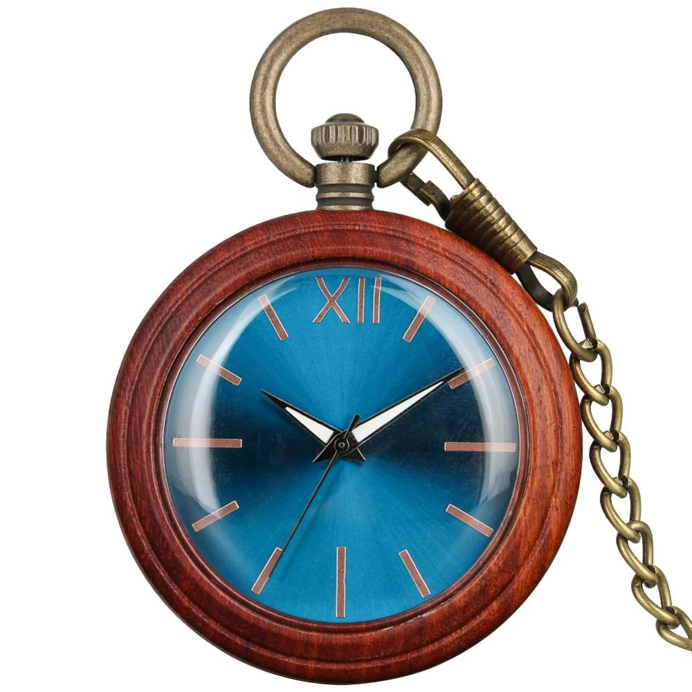 The Custom Vintage Antique Quartz Pocket Watch is a handmade wooden timepiece with a blue face, gold hour markers, Roman numeral XII at the top, and comes attached to a brass chain.