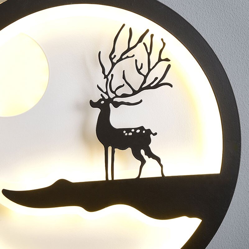 Minimalist Wall Lamp featuring a silhouette of a deer with branching antlers on a softly glowing circular background, ideal for a modern home.