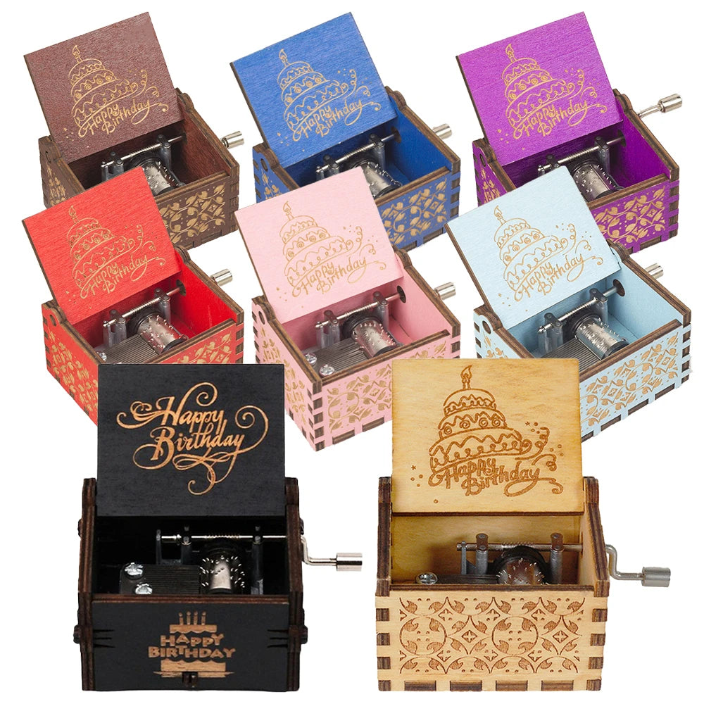 A set of nine vibrant Happy Birthday Music Boxes, each crafted from wood with an open-lid design showcasing a "Happy Birthday" cake motif. Inside every music box, there is a small, visible hand-crank mechanism.