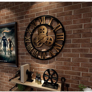 A Retro Gear Wall Clock featuring Roman numerals and intricate gear motifs is mounted on a brick wall, ideally placed above a shelf adorned with decor pieces and a framed poster.