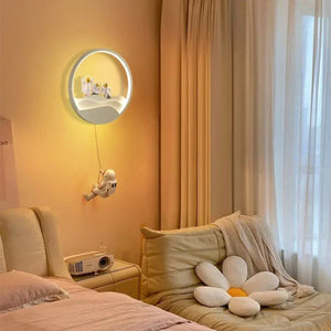 A cozy bedroom with a whimsical Star Astronaut Wall Light designed to look like an astronaut floating towards a celestial wonder.