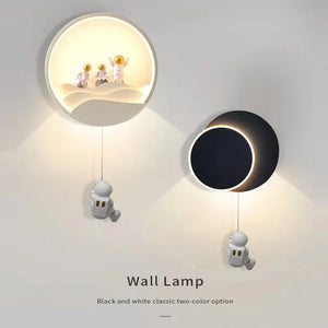 Two modern Star Astronaut Wall Light designed to resemble astronauts in space, available in classic black and white colors, capturing the celestial wonder for aspiring astronauts.