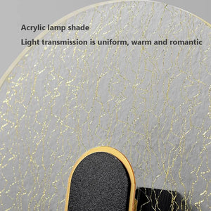 Close-up of a Beautiful Wall Sconce featuring an acrylic lamp shade with a wavy gold pattern. Text on the image reads "Acrylic lamp shade, Light transmission is uniform, warm and romantic." Perfect for adding a touch of minimalist design lighting to any space.