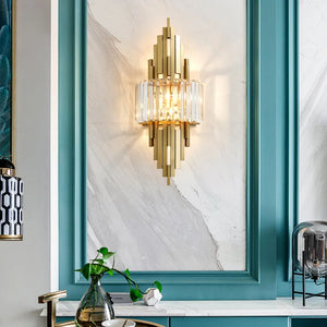 Transform your home decor with the Luxury Geometric Wall Sconce, showcasing an Art Deco design and exquisite glass detailing. Installed on a paneled wall and highlighted by teal trim, this crystal wall sconce infuses any space with an air of sophistication.