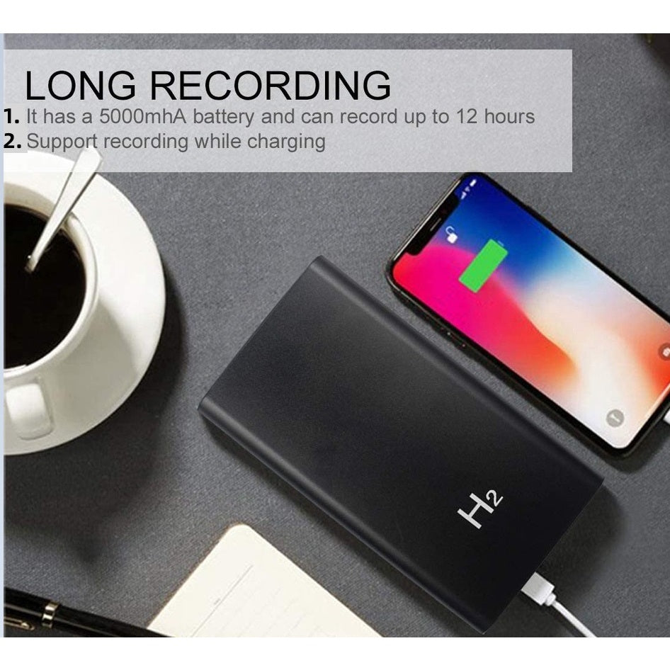 A smartphone charges on a desk near coffee, a notebook, and the Power Bank SpyCam—offering discreet recording features and a 5000mAh battery, perfect for anyone needing a hidden camera for added security.