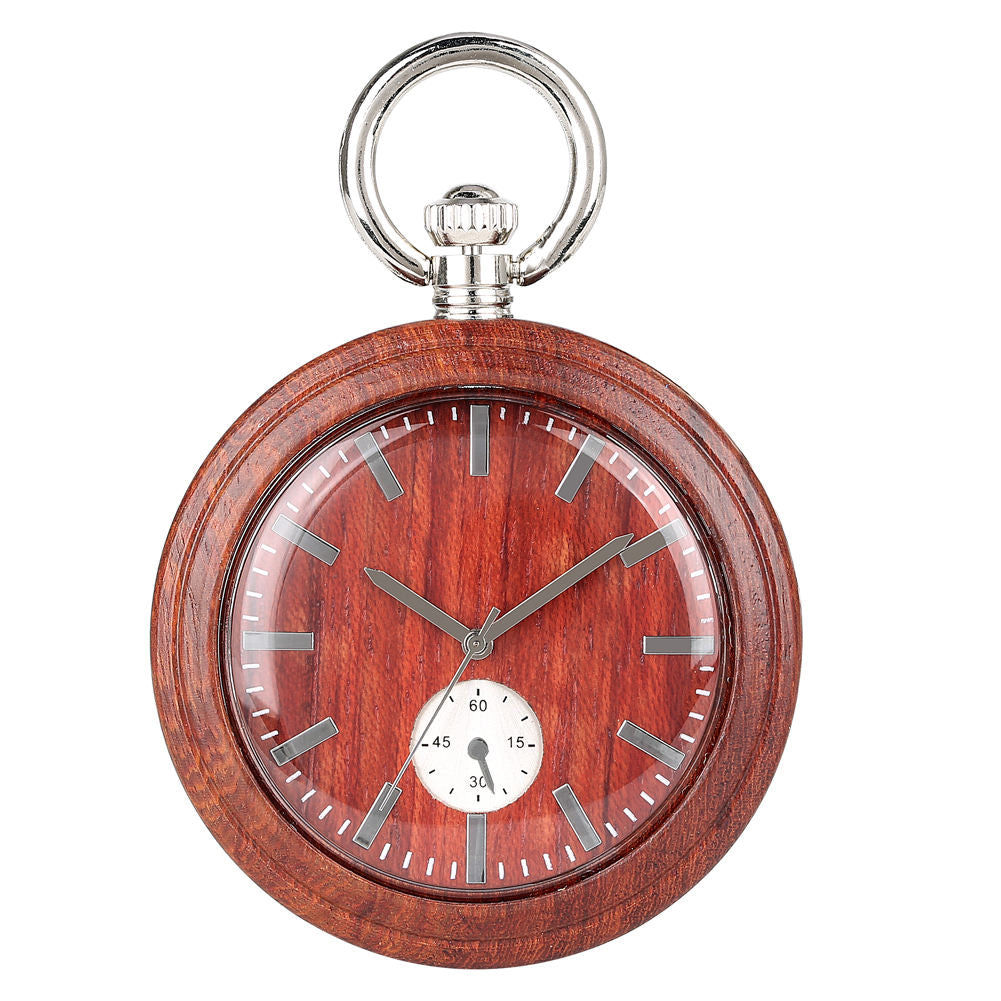 The Wood Pocket Watch is round and made of solid wood, featuring silver accents and a small seconds dial at the bottom center. The time displayed is about 1:55:20.