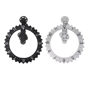 Two Ring Gear Wall Clocks, one in black and the other in white, featuring numerals and exposed mechanisms, bring a touch of modern interior elegance as they hang against a plain background. The design offers a captivating glimpse into their intricate workings.