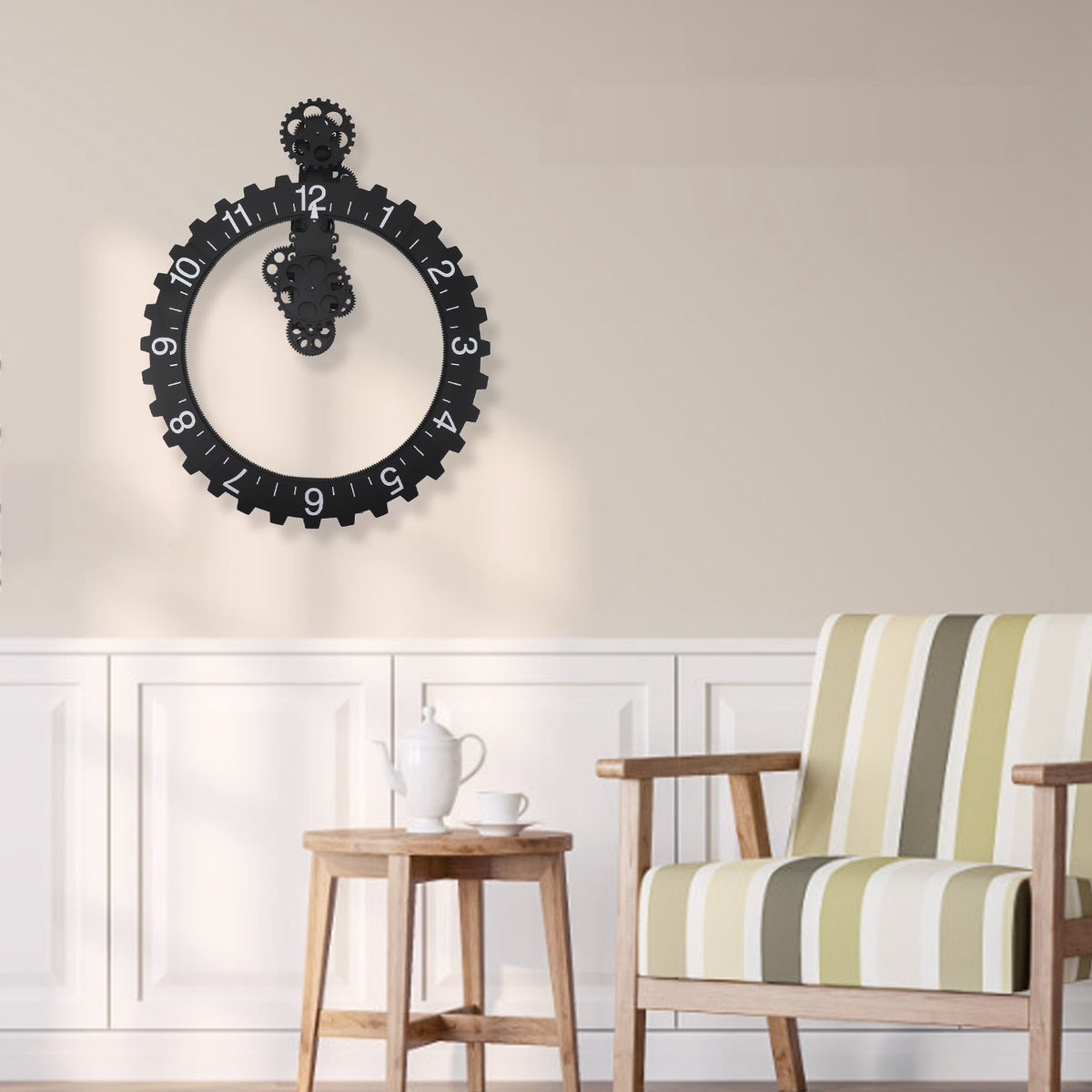 A modern interior showcases the impressive Ring Gear Wall Clock next to a striped armchair, paired with a wooden table that holds a teapot and cup, reflecting the essence of gear dynamics in its design.
