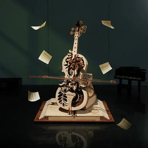 The Cello Puzzle Music Box is a captivating 3D wooden puzzle resembling a cello, complete with gears and intricate designs, elegantly positioned on an open book. Surrounding the sculpture, floating music sheets contribute to an enchanting scene, while a piano in the dimly lit background enhances the ambiance of this mechanical music box masterpiece.