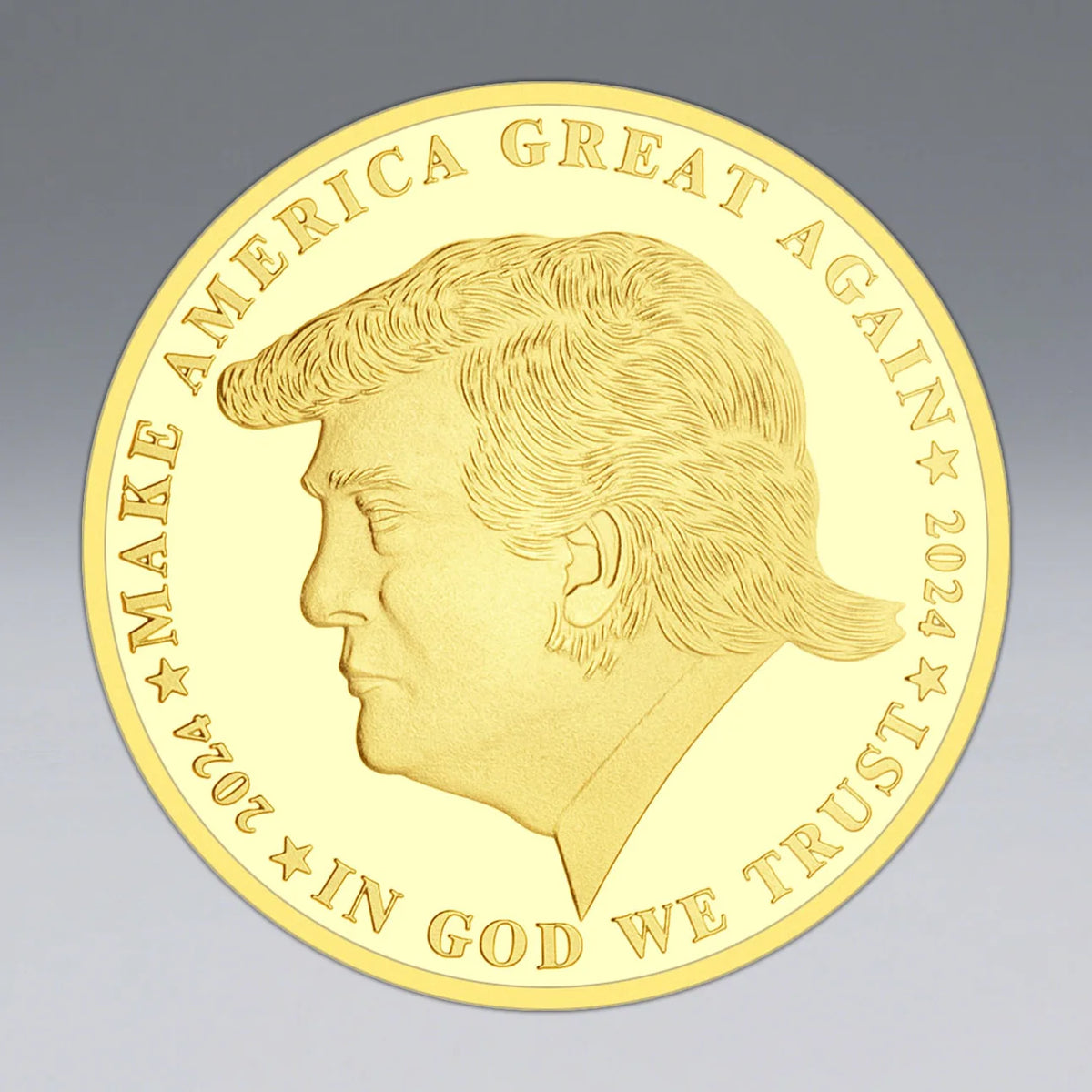 The Trump Commemorative Coin from the Save America Legacy Collection is gold-colored, featuring Donald Trump's side profile and inscribed with "MAKE AMERICA GREAT AGAIN 2024" and "IN GOD WE TRUST" around the edge.