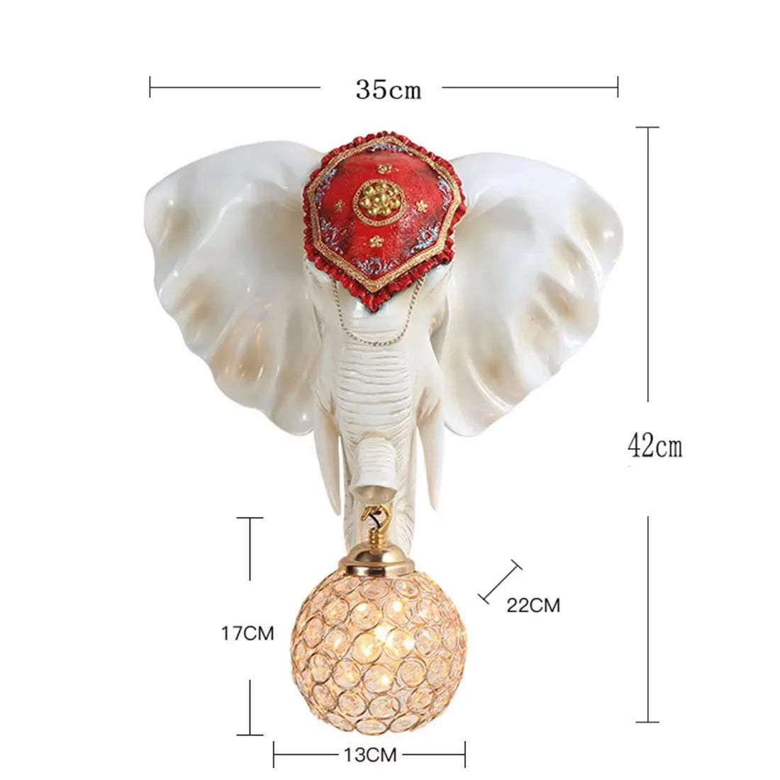 Enhance your space with the 3D Elephant Wall Light, showcasing a striking elephant head with a red decorative headpiece. It holds a spherical crystal-like bulb. Dimensions: 35cm wide, 42cm high; light drop of 17cm, light height of 22cm, and base width of 13cm.